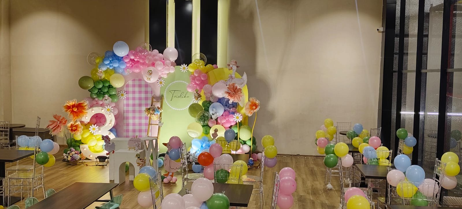 A pastel birthday setup inside the Happy Kydz party space